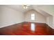 Bonus room with wood floors, sloped ceiling, and window at 2980 Milford Sw Trl, Marietta, GA 30008