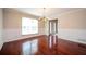 Formal dining room with beautiful hardwood floors, wainscotting, and a chandelier at 2980 Milford Sw Trl, Marietta, GA 30008