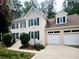 Beautiful two-story home featuring a two-car garage and traditional architectural details at 2980 Milford Sw Trl, Marietta, GA 30008
