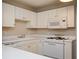 Well-lit kitchen with white appliances and countertops at 2980 Milford Sw Trl, Marietta, GA 30008