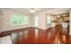 Open concept living space features hardwood floors and seamless transition to the kitchen at 2980 Milford Sw Trl, Marietta, GA 30008