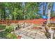 Fenced backyard featuring a swing set, chairs, and a grill at 3812 Maclaren Dr, Clarkston, GA 30021