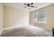 Comfortable bedroom featuring neutral walls and carpet and a large window for ample natural light at 3812 Maclaren Dr, Clarkston, GA 30021