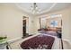 Elegant dining area with tray ceiling and open view of front living area and kitchen at 3812 Maclaren Dr, Clarkston, GA 30021