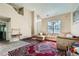Spacious living area with high ceilings, large window, and comfortable seating arrangement at 3812 Maclaren Dr, Clarkston, GA 30021