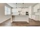 Spacious kitchen featuring an island with a sink, stainless steel appliances, and modern finishes at 3890 Ivy Cottage Dr, Snellville, GA 30039