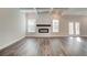 Spacious living room with fireplace and coffered ceilings, flooded with natural light at 3890 Ivy Cottage Dr, Snellville, GA 30039