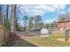 Backyard with a grass area and the boundary defined by a wooden fence and a chain-link fence at 665 Ferris St, Atlanta, GA 30310