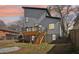Backyard view of the deck and stairs of a modern home under an orange sunset sky at 665 Ferris St, Atlanta, GA 30310