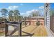 This backyard deck is made of wood and has a metal railing at 665 Ferris St, Atlanta, GA 30310