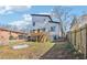 Modern two-story home with a backyard, featuring a wooden deck, steps, and nice landscaping at 665 Ferris St, Atlanta, GA 30310