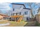 A modern two-story home with a backyard, a wooden deck and steps, and professional landscaping at 665 Ferris St, Atlanta, GA 30310