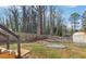 Backyard featuring a grass area and a boundary defined by a tall wooden fence at 665 Ferris St, Atlanta, GA 30310