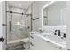 This bathroom features a glass shower with a marble surround and modern fixtures at 665 Ferris St, Atlanta, GA 30310