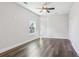 This bedroom features hardwood floors, a ceiling fan, and a window at 665 Ferris St, Atlanta, GA 30310