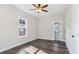 This bedroom features hardwood floors, a ceiling fan, and an ensuite bathroom at 665 Ferris St, Atlanta, GA 30310