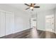 This bedroom features hardwood floors, a ceiling fan, and an ensuite bathroom at 665 Ferris St, Atlanta, GA 30310