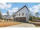 Modern two story home with a manicured lawn, boasts large windows and a stylish design at 665 Ferris St, Atlanta, GA 30310
