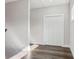 Hallway with hardwood floors, white trim, closet with folding doors, and natural light from a window at 665 Ferris St, Atlanta, GA 30310