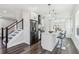 Open kitchen with stainless steel appliances, white cabinets, and a center island with bar seating at 665 Ferris St, Atlanta, GA 30310