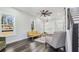 Bright living room features hardwood floors, ample natural light, and modern ceiling fan at 665 Ferris St, Atlanta, GA 30310