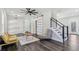Stylish living room features hardwood floors, modern lighting, and stairs to second level at 665 Ferris St, Atlanta, GA 30310