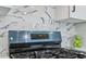 Close up view of a gas range with modern backsplash and stainless steel oven at 665 Ferris St, Atlanta, GA 30310