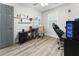 Bedroom featuring wood-look floors, a ceiling fan, and a gaming setup with computer at 874 Fox Valley Dr, Stone Mountain, GA 30088
