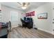 Bedroom with wood-look flooring, a ceiling fan, and a gaming setup with computer at 874 Fox Valley Dr, Stone Mountain, GA 30088