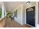 Inviting front porch with stylish chairs, wood floors, and a welcoming entrance to the home at 874 Fox Valley Dr, Stone Mountain, GA 30088