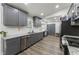 Bright kitchen with stainless appliances, gray cabinets and granite countertops at 874 Fox Valley Dr, Stone Mountain, GA 30088