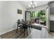 Eat-in kitchen with doors leading to the backyard patio with seating and a grill at 874 Fox Valley Dr, Stone Mountain, GA 30088