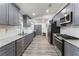 Kitchen with stainless appliances, gray cabinets and granite countertops at 874 Fox Valley Dr, Stone Mountain, GA 30088