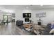 Cozy living room featuring an entertainment center, modern furnishings, and natural light at 874 Fox Valley Dr, Stone Mountain, GA 30088