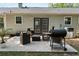 Outdoor patio with a grill, seating, and manicured landscaping, perfect for entertaining at 874 Fox Valley Dr, Stone Mountain, GA 30088