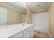 Well-lit bathroom featuring a white vanity, large mirror, and tub/shower combination at 10462 Bent Tree Vw, Duluth, GA 30097