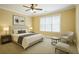 Cozy bedroom with neutral tones, a comfortable bed, and natural light from the window at 10462 Bent Tree Vw, Duluth, GA 30097