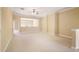 Large, open bonus room with neutral carpeting, ample space for entertaining, and a ceiling fan at 10462 Bent Tree Vw, Duluth, GA 30097
