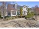 Charming home with dormer windows, black roof, manicured lawn, and beautiful curb appeal at 10462 Bent Tree Vw, Duluth, GA 30097