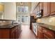 Well-appointed kitchen with stainless steel appliances, granite countertops, and a great view from large windows at 10462 Bent Tree Vw, Duluth, GA 30097