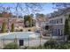 Community pool and townhomes featuring dormer windows, balconies, and brick and siding exteriors at 10462 Bent Tree Vw, Duluth, GA 30097