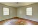 Bright bedroom with hardwood floors, neutral walls, and natural light creating a clean and inviting space at 1815 Windsor Sw Dr, Atlanta, GA 30311