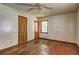 Bedroom featuring a ceiling fan, hardwood floors, neutral walls, closet, and a window at 1815 Windsor Sw Dr, Atlanta, GA 30311