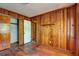 Cozy bedroom with wood paneled walls, closet space, and natural light providing a comfortable private retreat at 1815 Windsor Sw Dr, Atlanta, GA 30311