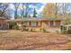 Charming brick home with covered porch and well-maintained landscaping in a peaceful, tree-lined neighborhood at 1815 Windsor Sw Dr, Atlanta, GA 30311