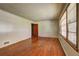Bright living room with hardwood floors, large windows, and neutral paint, offering a clean and inviting space at 1815 Windsor Sw Dr, Atlanta, GA 30311