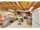 Unfinished basement workshop with pegboard wall, overhead lighting, and extra storage space at 3740 Laurel Brook Way, Snellville, GA 30039