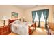 Bedroom with cozy furniture, a colorful quilt, and natural light at 3740 Laurel Brook Way, Snellville, GA 30039