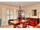 Elegant dining room featuring a large window, chandelier and classic decor at 3740 Laurel Brook Way, Snellville, GA 30039