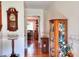 Hallway with hardwood floors, a grandfather clock, and decor at 3740 Laurel Brook Way, Snellville, GA 30039